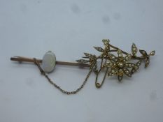 9ct floral design brooch inset with seed pearls, marked 9ct, together with unmarked yellow metal bar