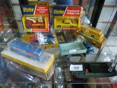 A selection of boxed and unboxed Dinky cars, to include buses, etc