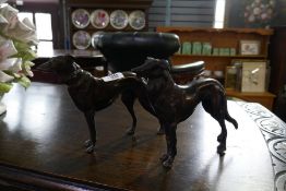 Bronze statute of a pair of dogs