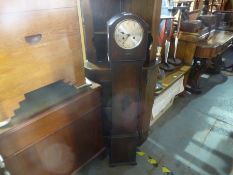 An oak shortcase clock
