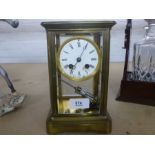 An old brass 4 glass mantle clock