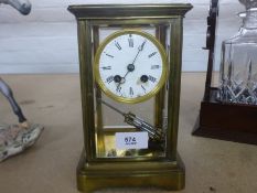 An old brass 4 glass mantle clock