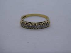 18ct yellow gold ring with 7 diamonds approx 0.10 carat each, set into band, marked 750, 3.2g approx
