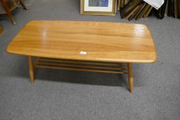 An Ercol medium oak rectangular coffee table with undertier - 104cm