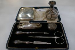 A silver manicure set hallmarked Birmingham 1918, G and C Ltd. Along with a silver sterling covered