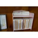 A quantity of Beatrix Potter books and Winnie the Pooh prints