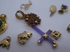 Collection of various 9ct yellow gold charms, silver gilt pendants, charms, 14K hardstone bound 14K