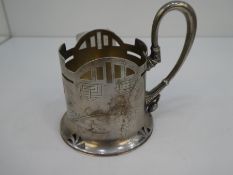 A silver Russian cup of decorative design with pierced decoration and ornate handle and engraved fol