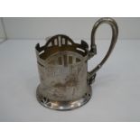A silver Russian cup of decorative design with pierced decoration and ornate handle and engraved fol