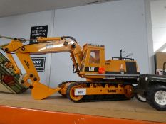 Three radio-controlled bulldozers, diggers, etc (manufactured by Quality Toys) plus a Tonka Jeep - w