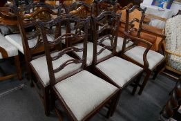 A set of 6 early 20th century mahogany dining chairs, 2 with arms, with wavy ladderback decoration