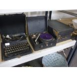 Two portable gramophones and an old Remington typewriter