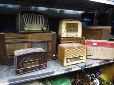 A shelf of vintage radios to include Phillips, Murphy and Solar