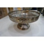 A large silver fruit bowl on a pedestal foot, with pierced rim decoration. Hallmarked Sheffield 1927