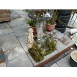 Stone effect bird bath depicting a boy, and 4 garden ornaments of men and children