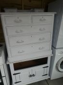 A painted wooden chest of drawers 2 small over  long, and a matching storage cupboard AF