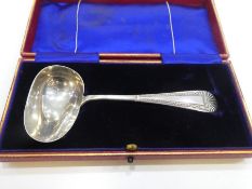 A silver suet spoon with pretty decorative handle hallmarked Sheffield 1907, Martin, Hall and Co., w