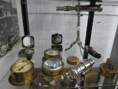 A shelf of reproduction compasses AF
