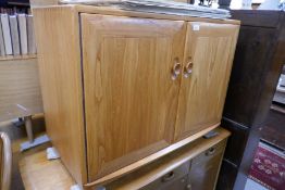 An Ercol elm 2 door cupboard and a sideboard having 3 drawers by Priory, the largest 122cm