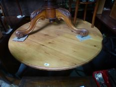 A modern pine circular kitchen table