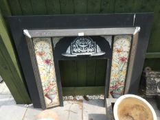 A reproduction metal and tile fireplace