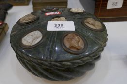 An old green marble circular inkwell with lid, decorated oval bust of gentleman