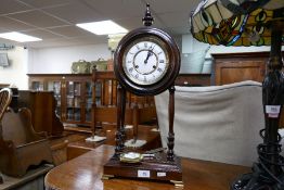 A reproduction mahogany 4 pillar clock having German movement, height 59cm