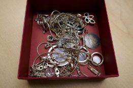 A small collection of mixed silver costume jewellery to include mother of pearl pendant, a cross on