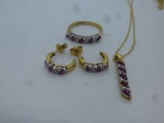 18c ruby and diamond ring, pair similar earrings and a pendant hung on 18t yellow gold chain, all ma