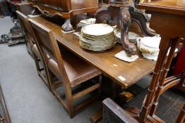 A repro oak refectory table and a set of 4 chairs having leather upholstery