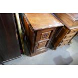 An early 20th Century bedside cupboard with two side flaps