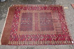 An old Bokhara and 2 others the largest 189 x 147cm and a quantity of cushions