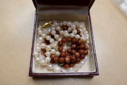 A freshwater pearl bracelet, a hardstone necklace and a string of pearls with 9ct gold clasp