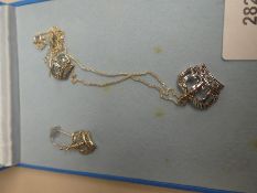 A sterling silver crown neck chain and matching earrings in box