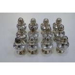 A quantity of twelve silver half reeded design peppers marked 800, total gross weight 8.26ozt approx