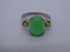 Silver dress ring with cabochon jade stone flaked 2 peridot, marked 925, size Q