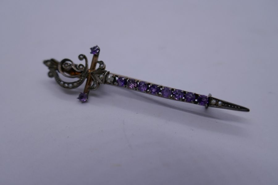 Victorian brooch in the form of a sword inset with 11 amethyst and seed pearls, marked 900, 6cm - Image 3 of 3