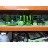 A quantity of glassware, jugs, bowls, decanters, etc, mostly uranium green