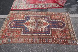 An old geometric rug having central design, 214 x 120cm