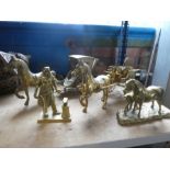 A selection of heavy style brass ornaments to include horse and carts, Blacksmith, etc