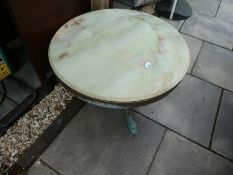 A round Alabaster and brass table and a wooden drop leaf table