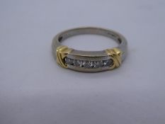18ct white and yellow gold band ring with 5 brilliant cut diamonds, marked 750, size R, 6.2g approx