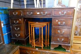 A reproduction mahogany twin pedestal desk