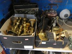 Two boxes of brassware to include candlesticks, brushes, ornaments, magazine rack, and a copper kett