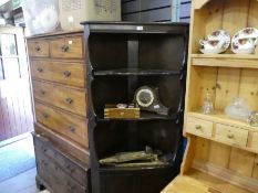 A corner display unit with 3 shelves over a cupboard