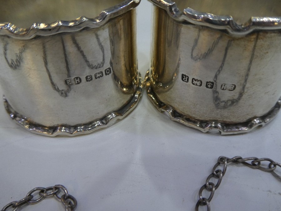 Four silver decanter labels of ornate decoration and various hallmarks and a pair of thick, silver n - Image 9 of 10