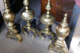 Two pairs of brass fire dogs