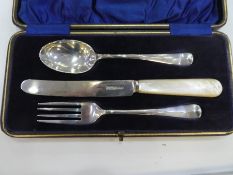 A set of silver fork, knife and spoon, cased, hallmarked Sheffield 1933 George Bishop and Sons, heav