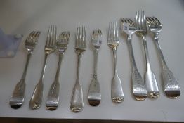 A set of three Georgian silver dinner forks with an engraved Clan Castle and 'Fortis et Fidus' stron