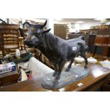 A reproduction bronze style sculpture of bull, the base signed, 55cm